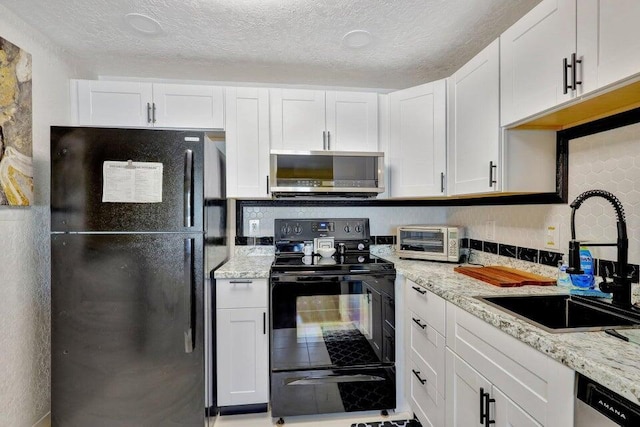 278 Monaco Way Unit F, Delray Beach, FL 33446 - kitchen featuring black appliances, a sink, white cabinets, light stone counters, and a textured ceiling