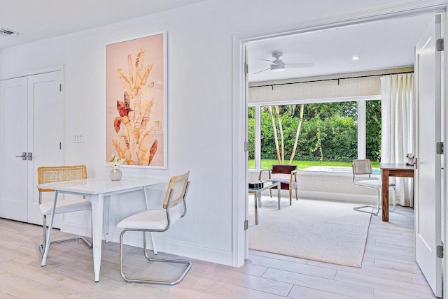 215 Cortez Rd, West Palm Beach, FL 33405 - dining area with light wood-style floors and a ceiling fan