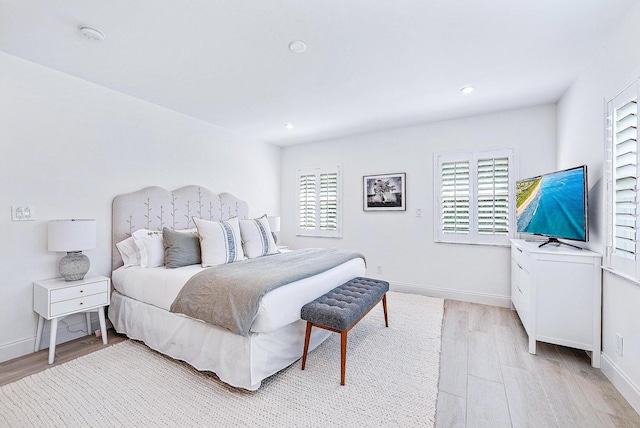 215 Cortez Rd, West Palm Beach, FL 33405 - bedroom featuring multiple windows, light wood-style floors, baseboards, and recessed lighting