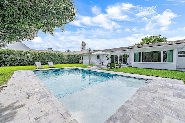 215 Cortez Rd, West Palm Beach, FL 33405 - view of swimming pool featuring a patio and a yard