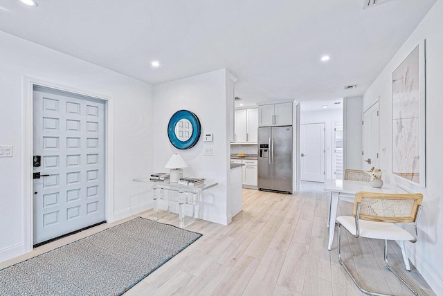 215 Cortez Rd, West Palm Beach, FL 33405 - entrance foyer with light wood-type flooring, baseboards, and recessed lighting