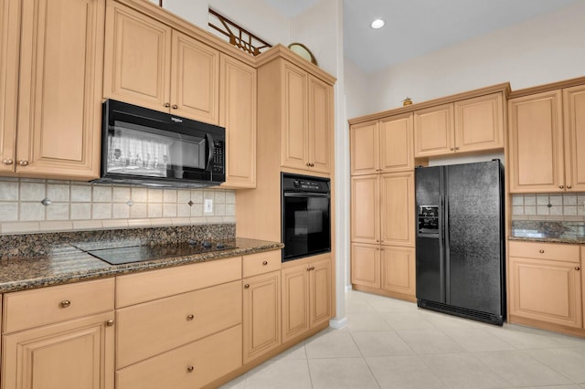 7144 Demedici Cir, Delray Beach, FL 33446 - kitchen with black appliances, tasteful backsplash, dark stone countertops, light tile patterned flooring, and recessed lighting