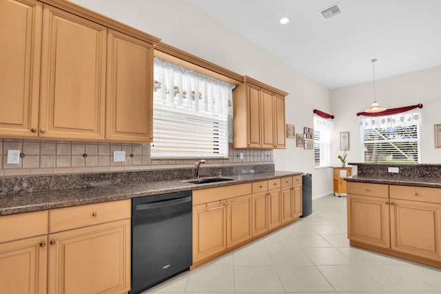 7144 Demedici Cir, Delray Beach, FL 33446 - kitchen with black dishwasher, tasteful backsplash, hanging light fixtures, dark stone counters, and light tile patterned floors