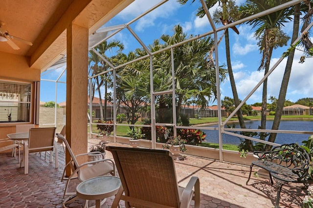 7144 Demedici Cir, Delray Beach, FL 33446 - sunroom with a water view, a ceiling fan, and outdoor dining space
