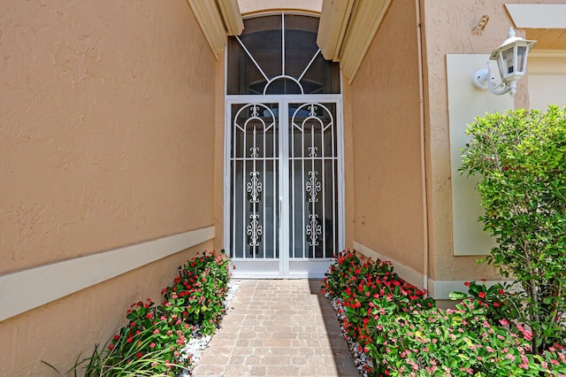 7144 Demedici Cir, Delray Beach, FL 33446 - doorway to property featuring stucco siding