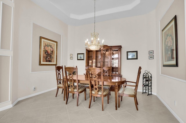 7144 Demedici Cir, Delray Beach, FL 33446 - dining room with a chandelier, light tile patterned floors, and a tray ceiling