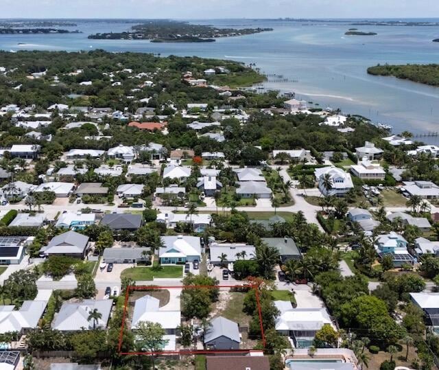 5666 SE Matousek St, Stuart, FL 34997 - aerial view of residential area featuring a large body of water