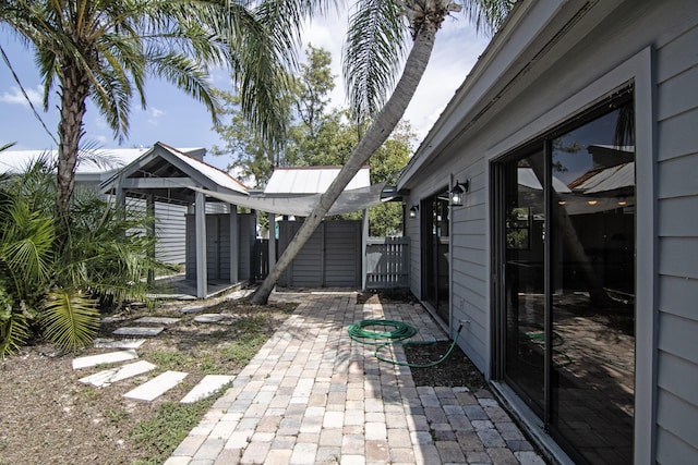 5666 SE Matousek St, Stuart, FL 34997 - view of patio featuring a gate