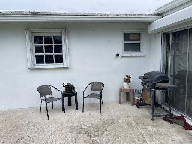 108 SW 18th St, Boynton Beach, FL 33426 - view of patio featuring a grill