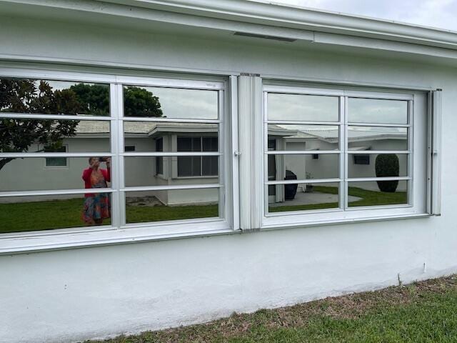 108 SW 18th St, Boynton Beach, FL 33426 - view of home's exterior with stucco siding