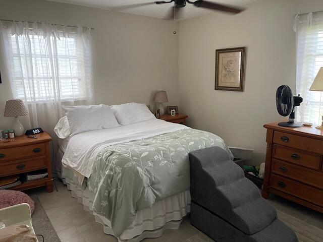108 SW 18th St, Boynton Beach, FL 33426 - bedroom featuring multiple windows and a ceiling fan
