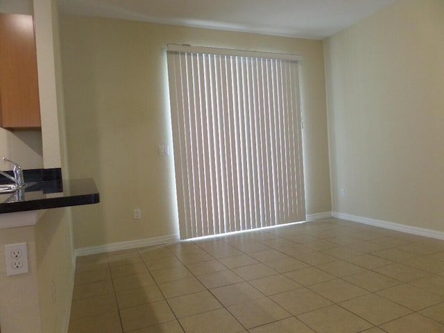 328 Lake Monterey Cir, Boynton Beach, FL 33426 - unfurnished living room featuring light tile patterned floors, a sink, and baseboards