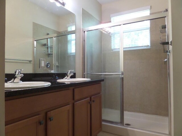 328 Lake Monterey Cir, Boynton Beach, FL 33426 - bathroom featuring a shower stall and double vanity