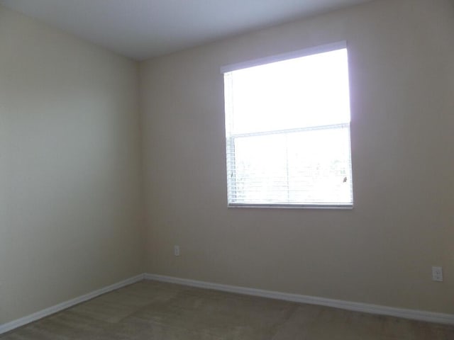 328 Lake Monterey Cir, Boynton Beach, FL 33426 - empty room featuring baseboards and light colored carpet
