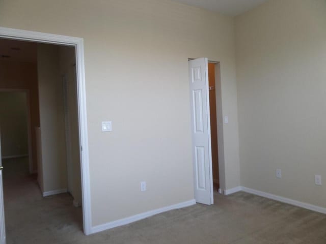 328 Lake Monterey Cir, Boynton Beach, FL 33426 - unfurnished room featuring light carpet and baseboards