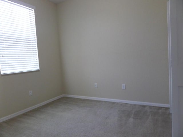 328 Lake Monterey Cir, Boynton Beach, FL 33426 - spare room featuring light colored carpet, plenty of natural light, and baseboards
