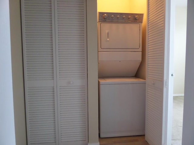328 Lake Monterey Cir, Boynton Beach, FL 33426 - washroom featuring stacked washer / dryer