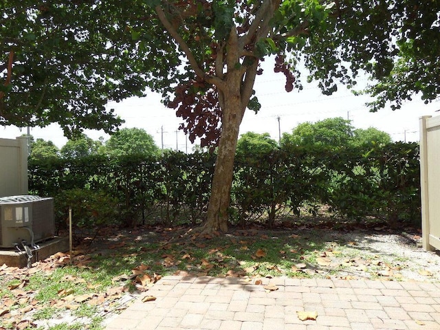 328 Lake Monterey Cir, Boynton Beach, FL 33426 - view of yard with central AC unit and a patio