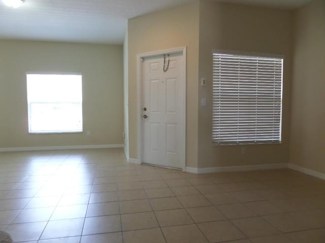 328 Lake Monterey Cir, Boynton Beach, FL 33426 - entrance foyer with light tile patterned flooring and baseboards