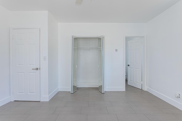 1715 12th Ave N, Lake Worth Beach, FL 33460 - unfurnished bedroom featuring a closet and a ceiling fan