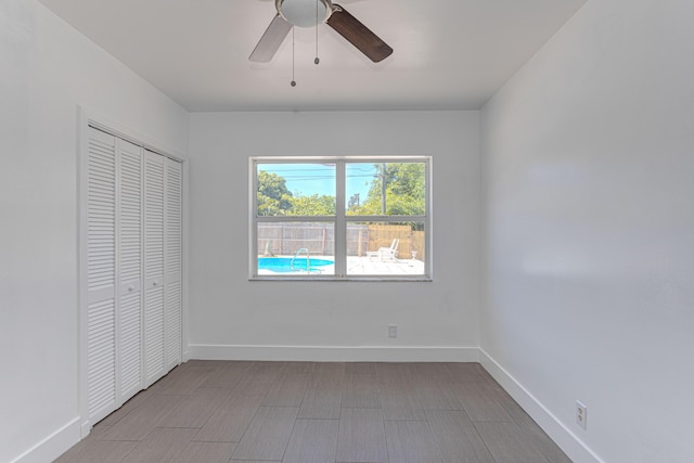 1715 12th Ave N, Lake Worth Beach, FL 33460 - unfurnished bedroom with a closet and a ceiling fan
