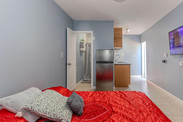 1715 12th Ave N, Lake Worth Beach, FL 33460 - bedroom featuring freestanding refrigerator and light tile patterned floors