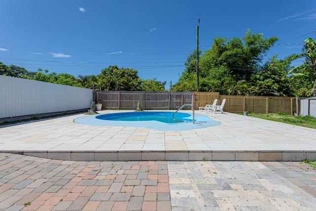 1715 12th Ave N, Lake Worth Beach, FL 33460 - view of pool featuring a fenced backyard and a patio