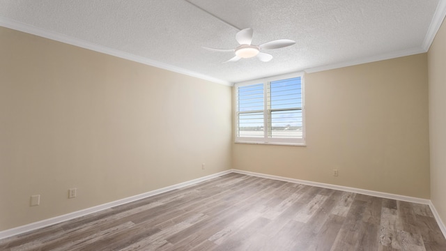 1950 SW Palm City Rd Unit 8302, Stuart, FL 34994 - unfurnished room with wood finished floors, a textured ceiling, a ceiling fan, crown molding, and baseboards