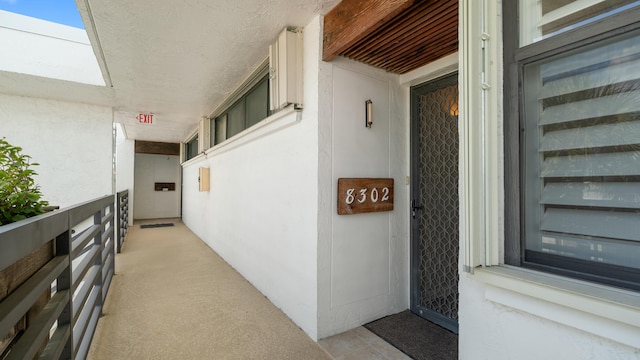 1950 SW Palm City Rd Unit 8302, Stuart, FL 34994 - property entrance featuring stucco siding