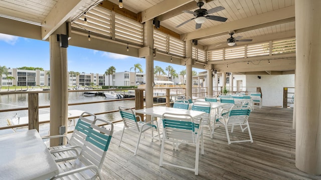 1950 SW Palm City Rd Unit 8302, Stuart, FL 34994 - wooden terrace with a water view, ceiling fan, a residential view, and outdoor dining area