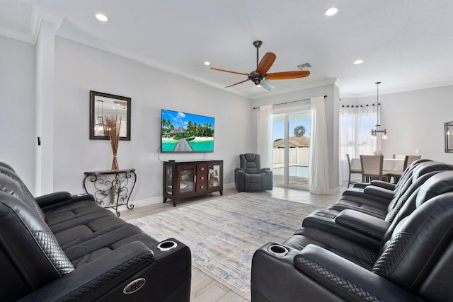 979 SW Mcdevitt Ave, Port Saint Lucie, FL 34953 - living room with a ceiling fan, recessed lighting, light wood finished floors, crown molding, and baseboards