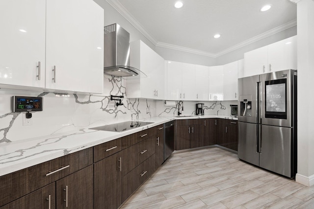 979 SW Mcdevitt Ave, Port Saint Lucie, FL 34953 - kitchen with appliances with stainless steel finishes, wall chimney exhaust hood, white cabinets, dark brown cabinets, and crown molding