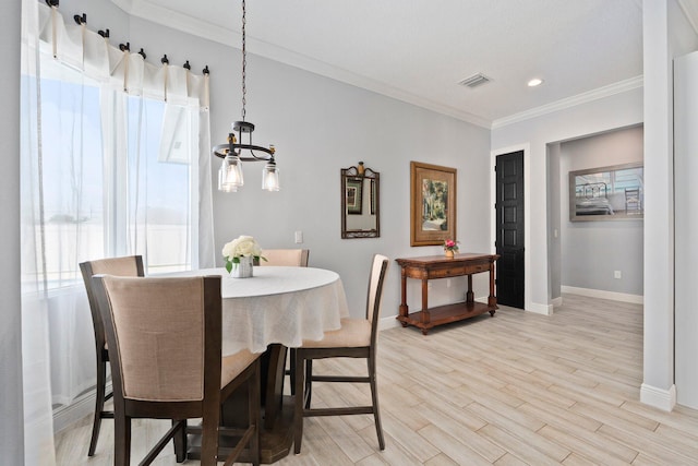 979 SW Mcdevitt Ave, Port Saint Lucie, FL 34953 - dining space featuring baseboards, crown molding, light wood-type flooring, a chandelier, and recessed lighting