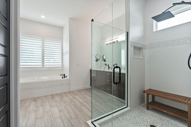 979 SW Mcdevitt Ave, Port Saint Lucie, FL 34953 - full bathroom featuring a stall shower, a bath, vanity, and recessed lighting