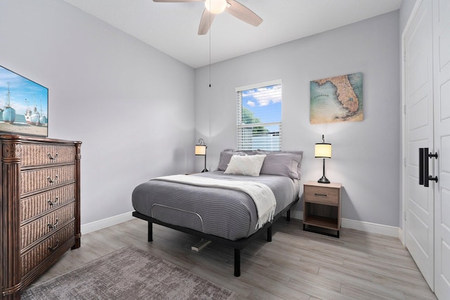 979 SW Mcdevitt Ave, Port Saint Lucie, FL 34953 - bedroom featuring baseboards, light wood finished floors, and a ceiling fan