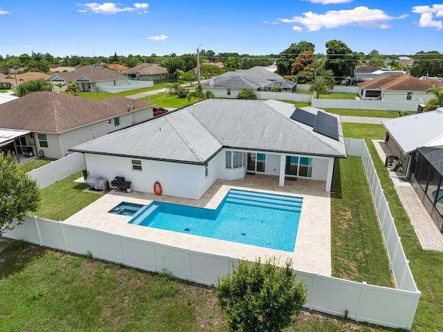 979 SW Mcdevitt Ave, Port Saint Lucie, FL 34953 - view of pool with a patio, a residential view, and a pool with connected hot tub