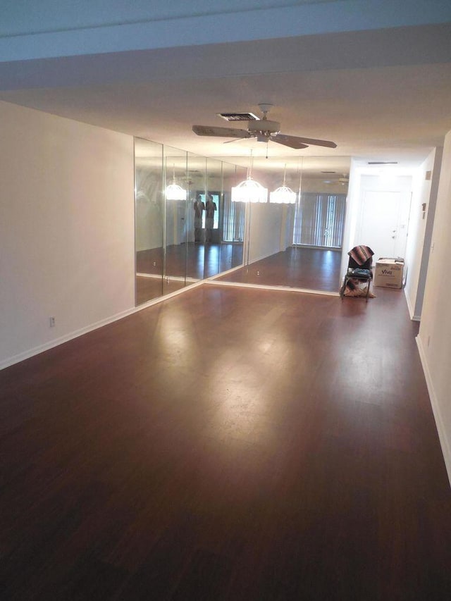 13907 Via Aurora Unit A, Delray Beach, FL 33484 - empty room with wood finished floors, baseboards, and ceiling fan
