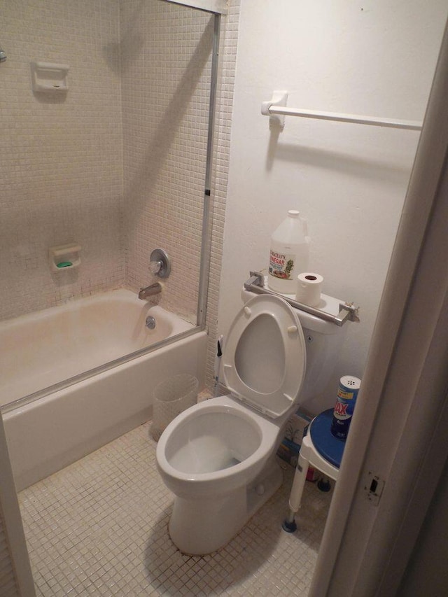 13907 Via Aurora Unit A, Delray Beach, FL 33484 - bathroom featuring  shower combination, toilet, and tile patterned floors