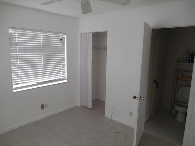 13907 Via Aurora Unit A, Delray Beach, FL 33484 - unfurnished bedroom with a closet, ceiling fan, and baseboards