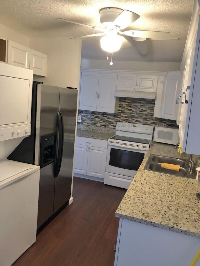 13907 Via Aurora Unit A, Delray Beach, FL 33484 - kitchen with white appliances, a sink, dark wood-type flooring, white cabinetry, and tasteful backsplash