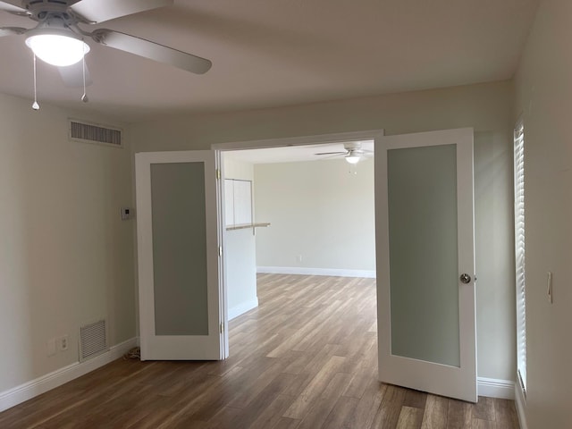 639 Executive Center Dr Unit O-204, West Palm Beach, FL 33401 - unfurnished room with ceiling fan, wood finished floors, and baseboards