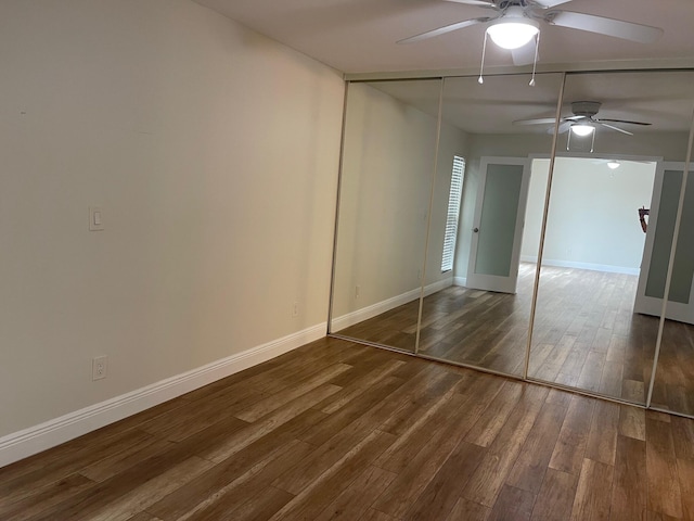 639 Executive Center Dr Unit O-204, West Palm Beach, FL 33401 - unfurnished bedroom featuring wood finished floors, baseboards, and ceiling fan