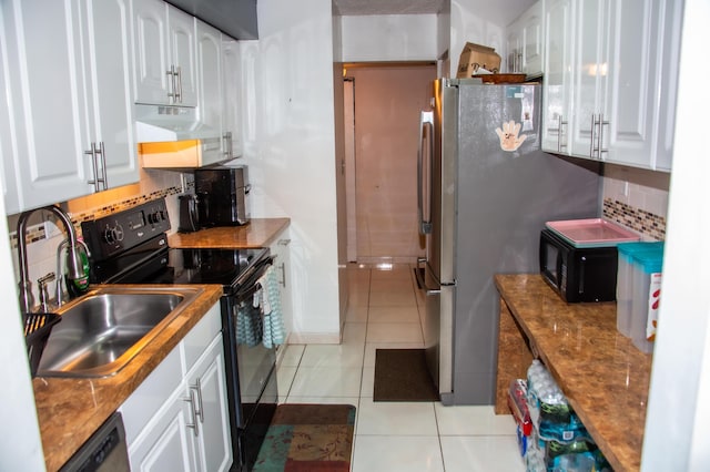 3821 Environ Blvd Unit 203, Lauderhill, FL 33319 - kitchen with black appliances, light tile patterned floors, white cabinetry, decorative backsplash, and a sink