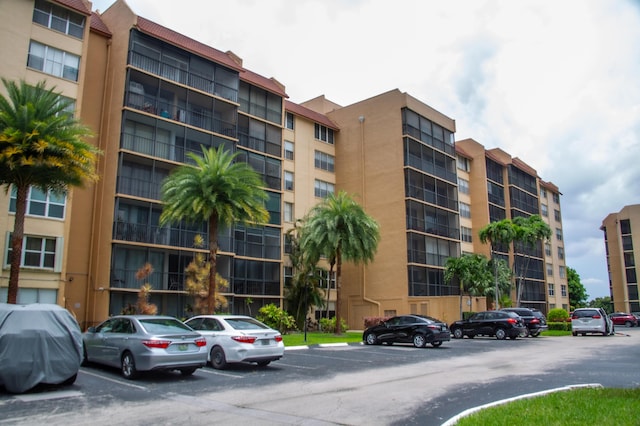 3821 Environ Blvd Unit 203, Lauderhill, FL 33319 - view of apartment building / complex featuring uncovered parking