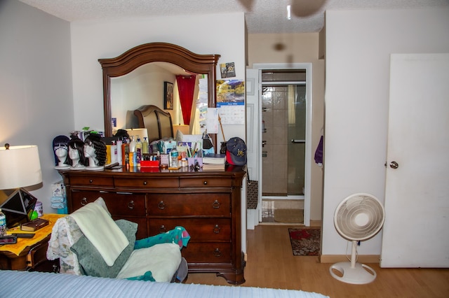 3821 Environ Blvd Unit 203, Lauderhill, FL 33319 - bedroom featuring wood finished floors and a textured ceiling