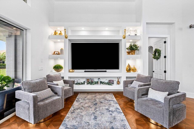 107 SE Santa Gardenia, Port Saint Lucie, FL 34984 - living room featuring crown molding, a high ceiling, and beam ceiling