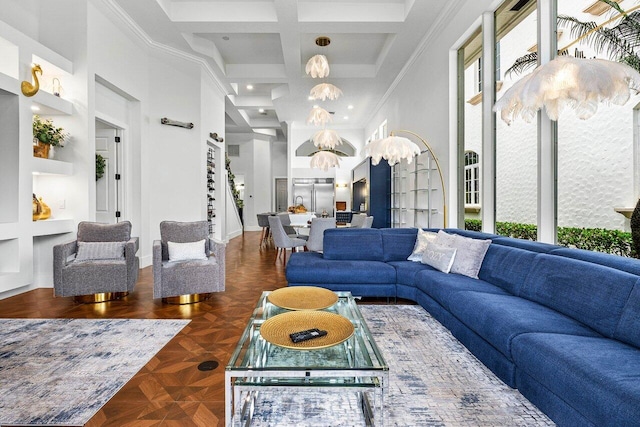 107 SE Santa Gardenia, Port Saint Lucie, FL 34984 - living area featuring a chandelier, a towering ceiling, ornamental molding, coffered ceiling, and beam ceiling