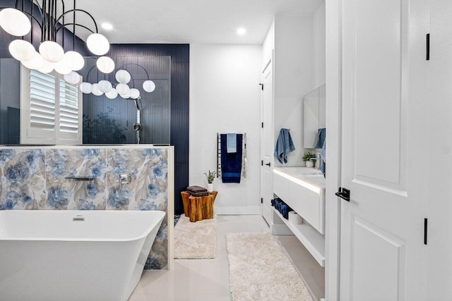 107 SE Santa Gardenia, Port Saint Lucie, FL 34984 - bathroom featuring a soaking tub, a chandelier, vanity, and recessed lighting