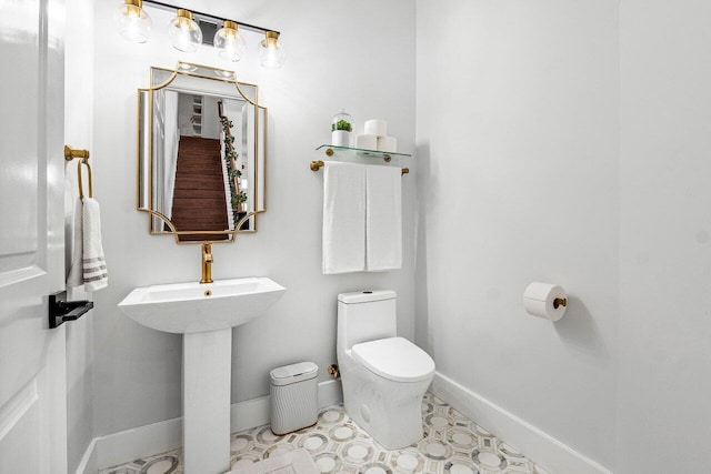 107 SE Santa Gardenia, Port Saint Lucie, FL 34984 - bathroom featuring toilet and baseboards