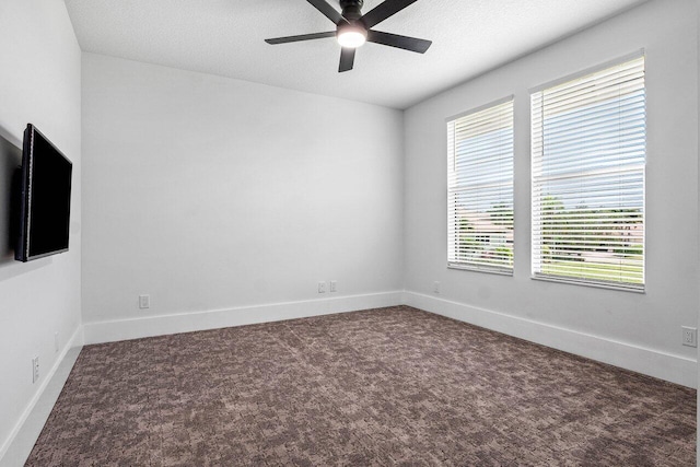 107 SE Santa Gardenia, Port Saint Lucie, FL 34984 - carpeted spare room featuring a ceiling fan, baseboards, and a textured ceiling